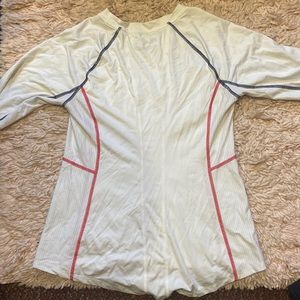 Back of white Fila long sleeve top